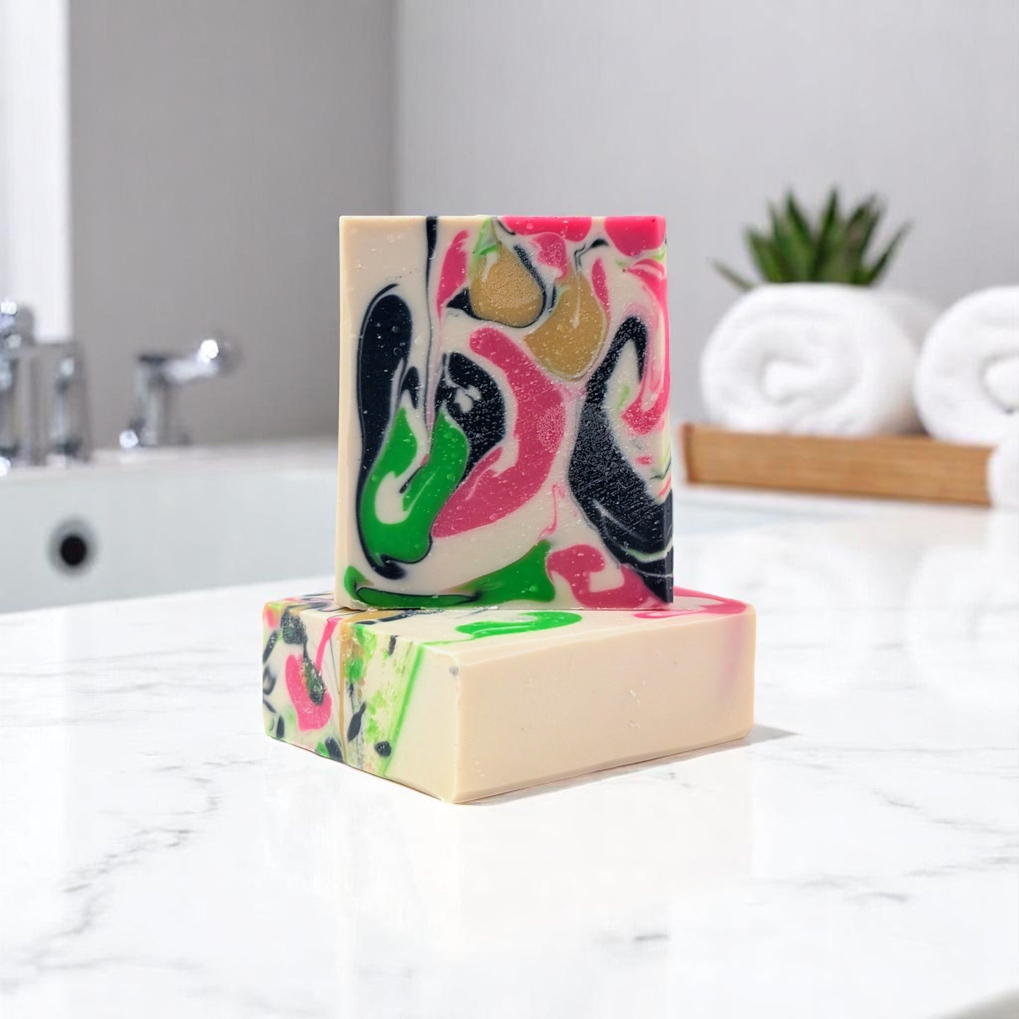  handmade coconut milk soap bar with a soft swirl design, scented with bright citrus, floral jasmine and lavender, and a sweet vanilla musk base.