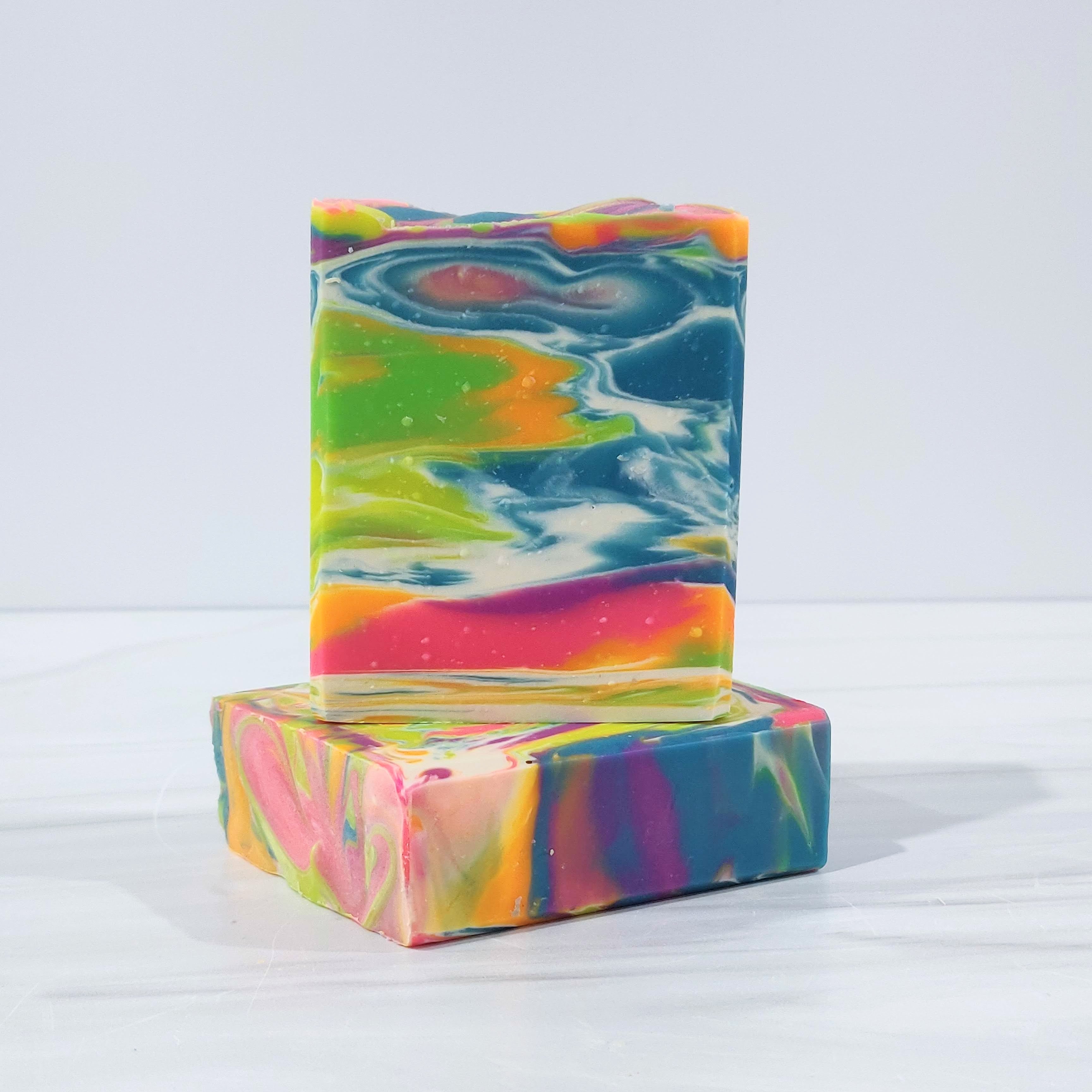 Taste the Rainbow handmade soap with vibrant rainbow swirls, scented like fruity cereal with notes of citrus, berries, and vanilla. Fun, colorful, and nostalgic.