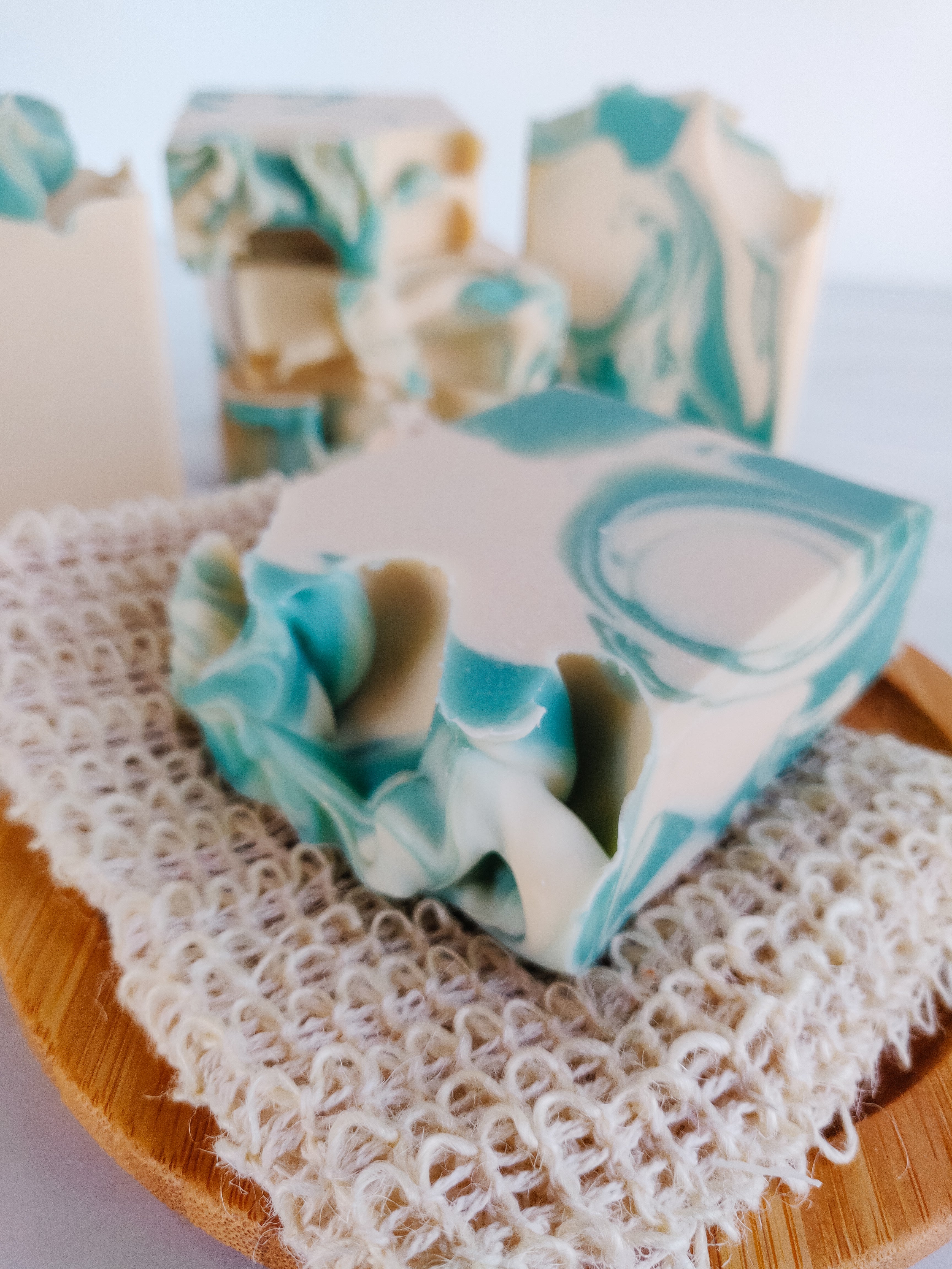 a cake with white frosting and candles on a table 